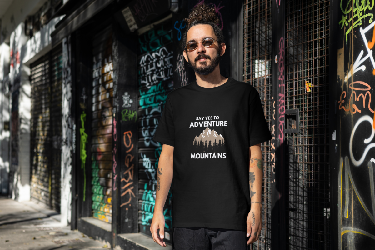 Oversized t-shirt with "Say Yes to Adventure" and mountain graphics