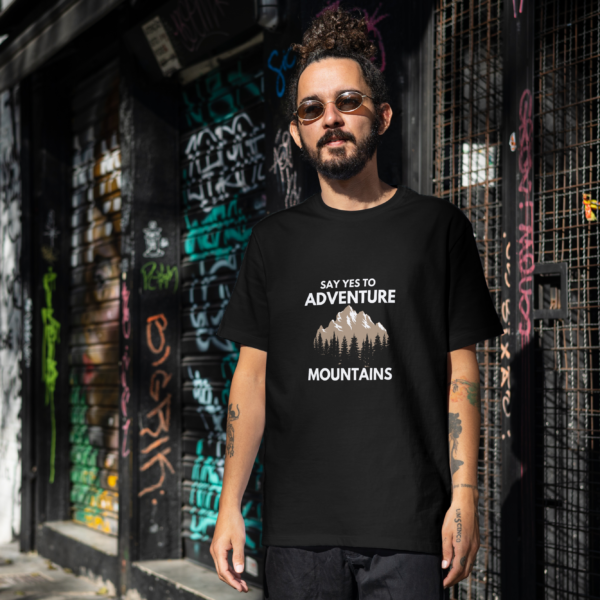 Oversized t-shirt with "Say Yes to Adventure" and mountain graphics